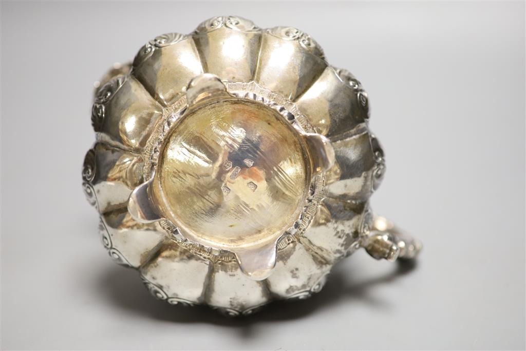 A George IV Irish silver squat melon shaped cream jug, James Le Bas, Dublin, 1828, height 11.2cm, 12oz.